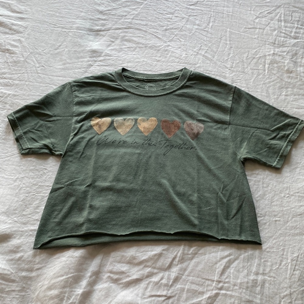 Small, green crop-top made by the brand social culture